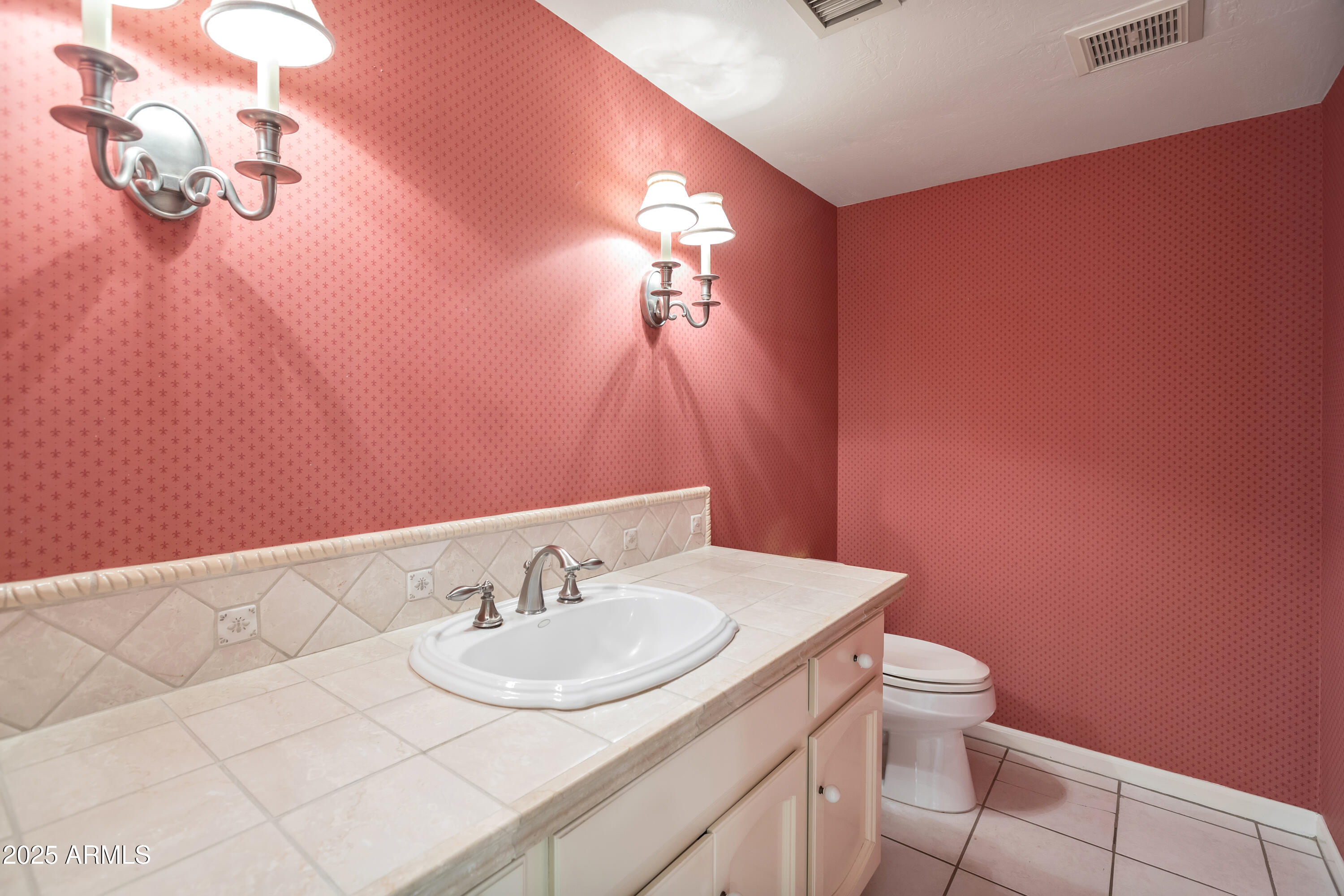 6701 North Scottsdale Road, Unit 23 Scottsdale, AZ 85250 - Photo 25 of 47 a bathroom with a sink vanity mirror and toilet