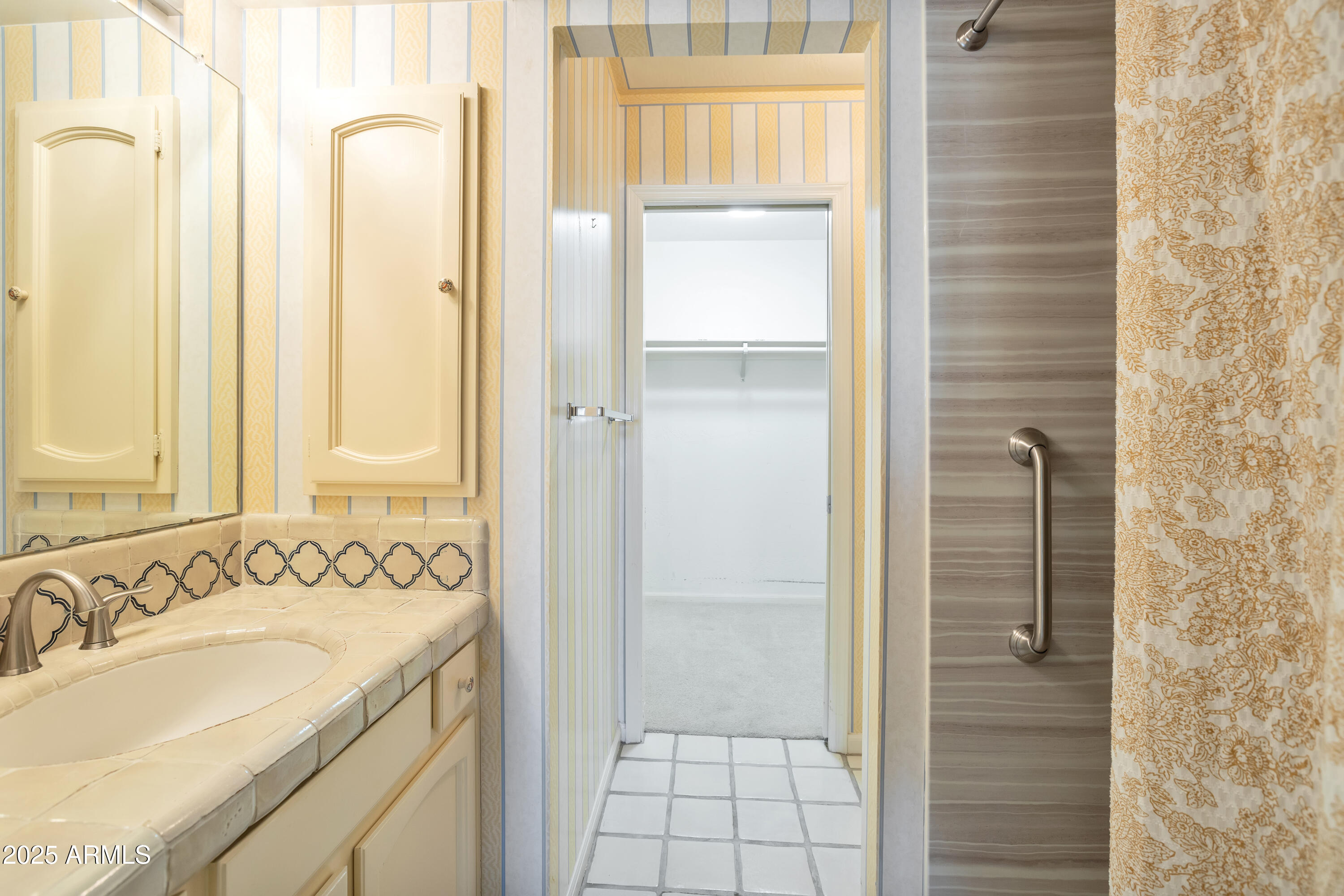 6701 North Scottsdale Road, Unit 23 Scottsdale, AZ 85250 - Photo 28 of 47 a bathroom with a granite countertop sink and a mirror