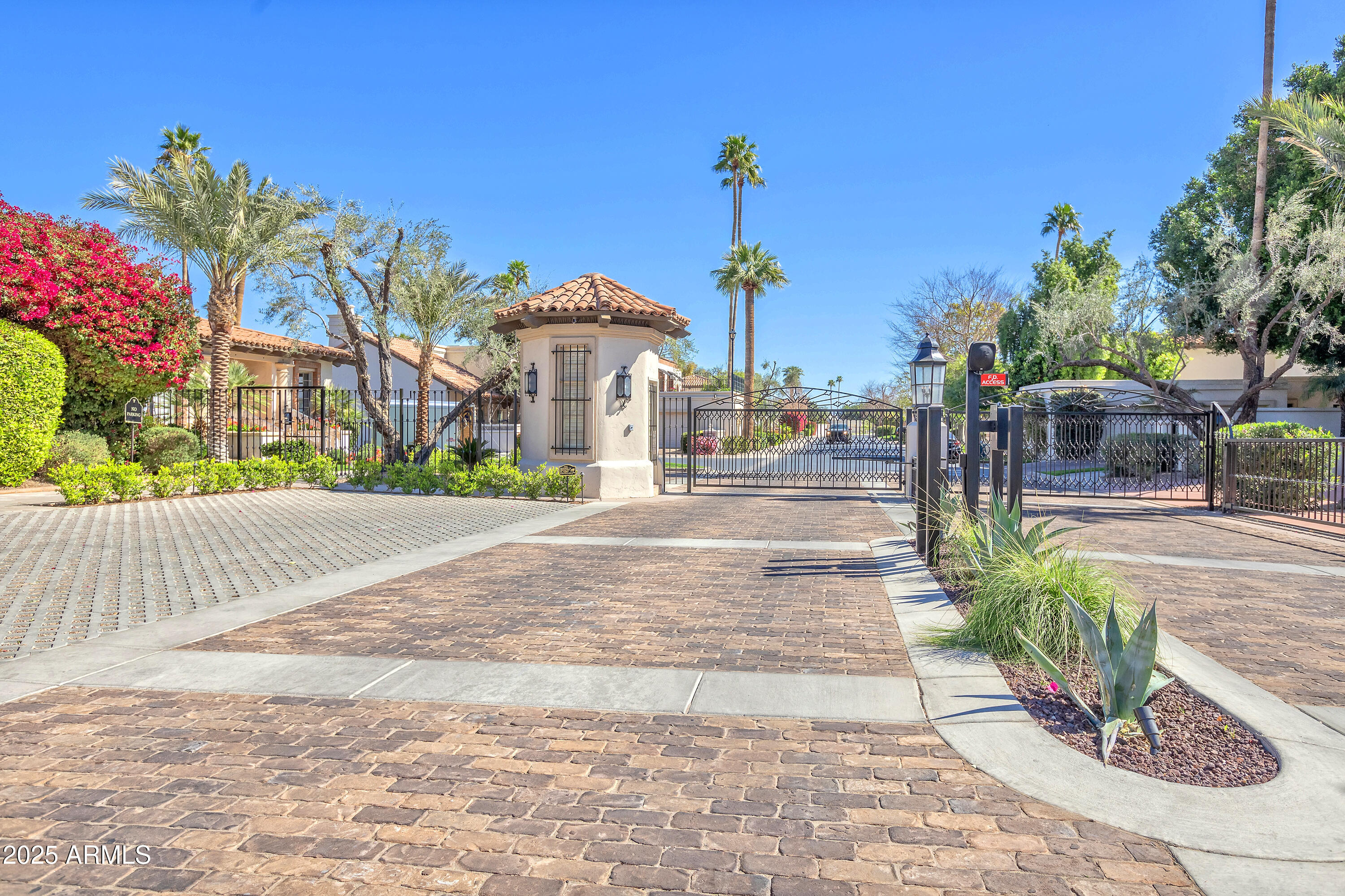 6701 North Scottsdale Road, Unit 23 Scottsdale, AZ 85250 - Photo 3 of 47 a front view of a house with a yard