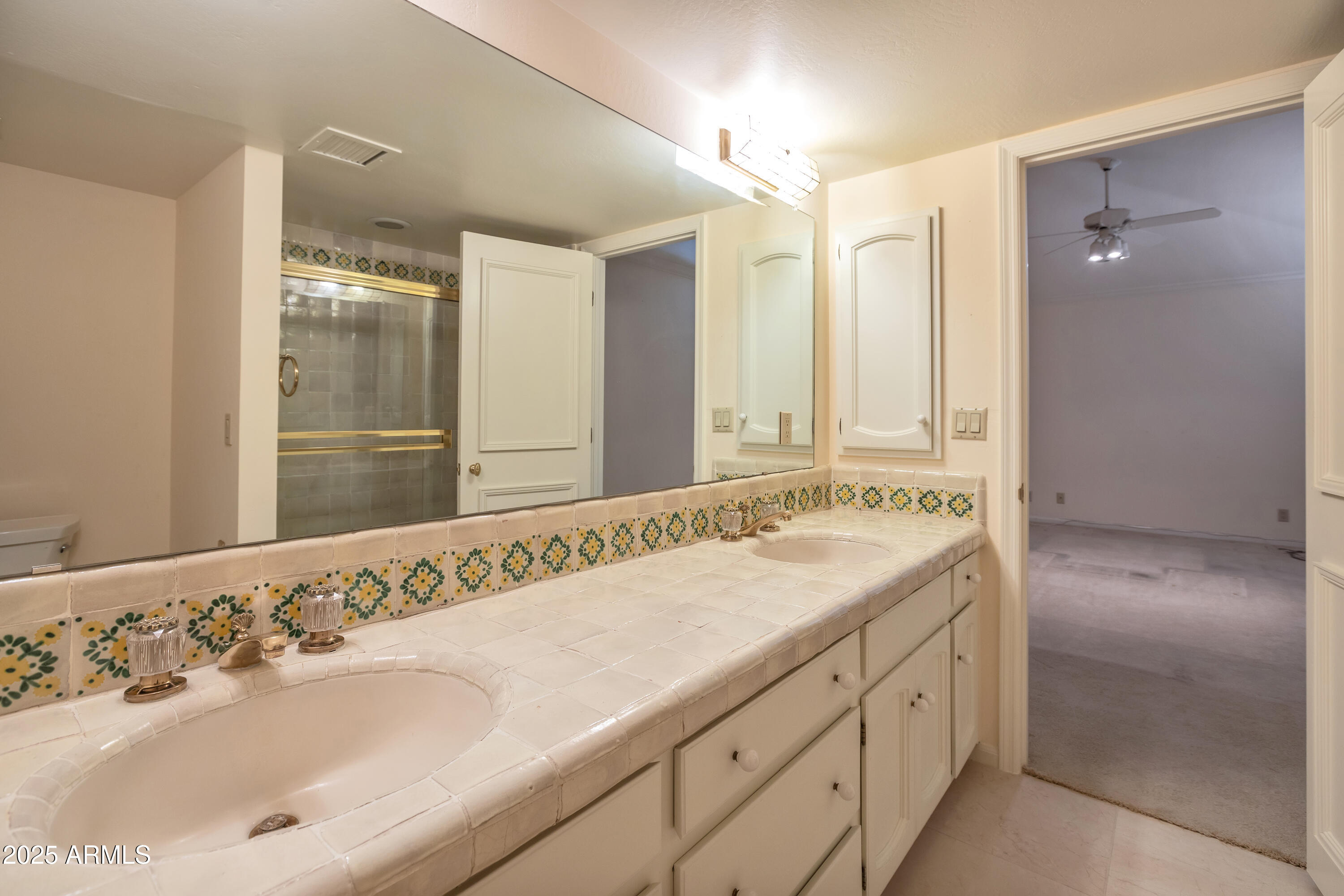 6701 North Scottsdale Road, Unit 23 Scottsdale, AZ 85250 - Photo 36 of 47 a bathroom with a sink and a mirror