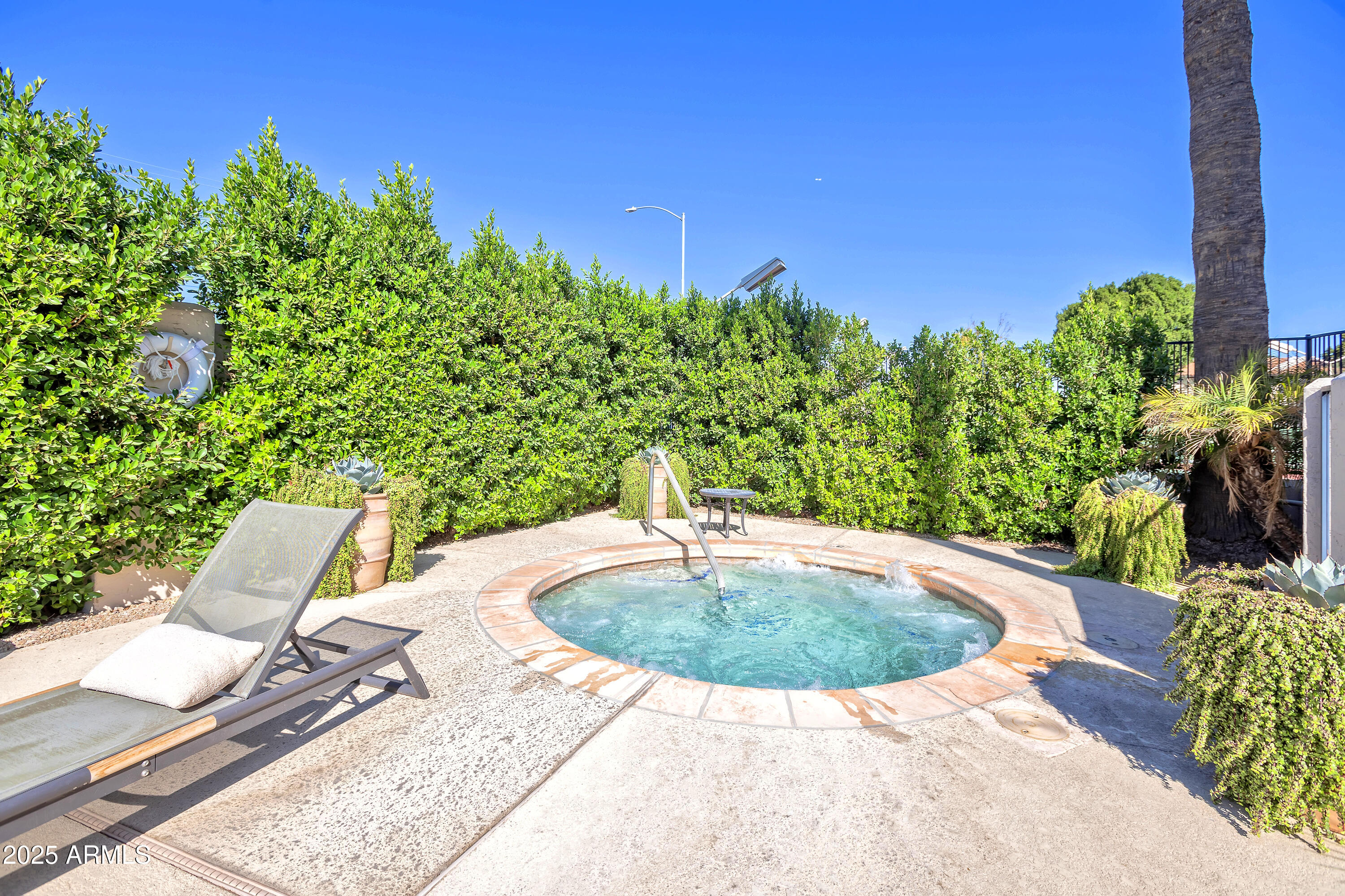 6701 North Scottsdale Road, Unit 23 Scottsdale, AZ 85250 - Photo 40 of 47 a view of a swimming pool with a patio