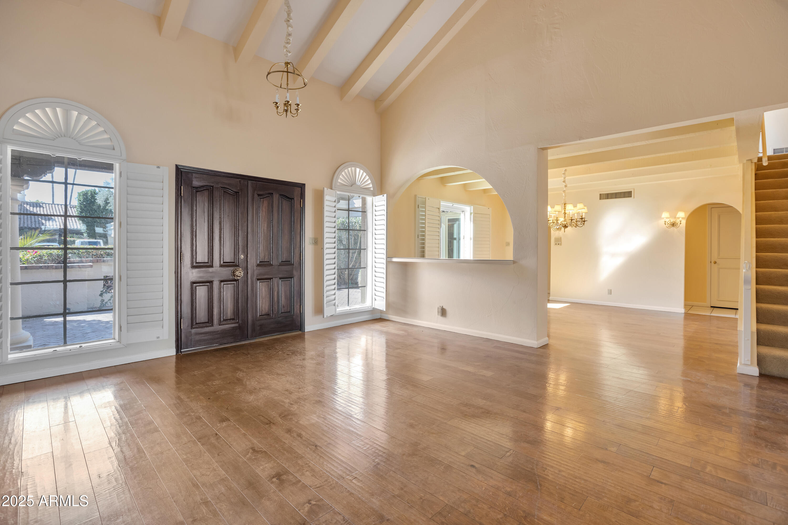 6701 North Scottsdale Road, Unit 23 Scottsdale, AZ 85250 - Photo 5 of 47 a view of empty room with wooden floor and fan