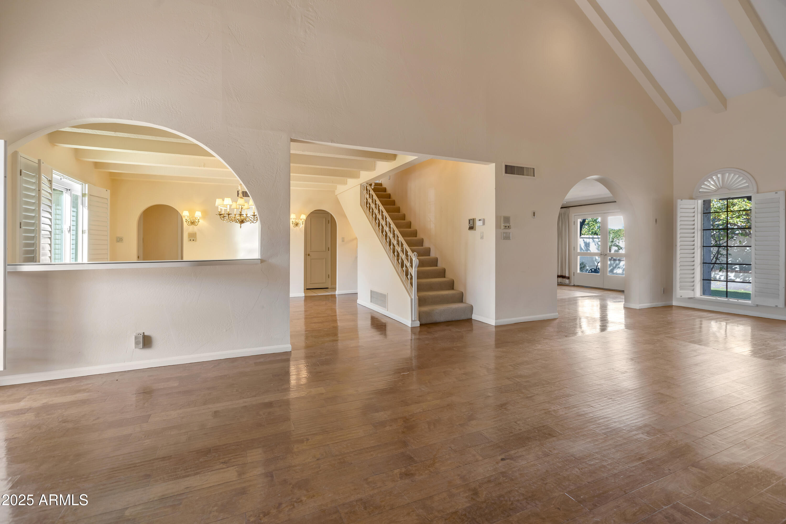 6701 North Scottsdale Road, Unit 23 Scottsdale, AZ 85250 - Photo 7 of 47 wooden floor in an empty room with a window