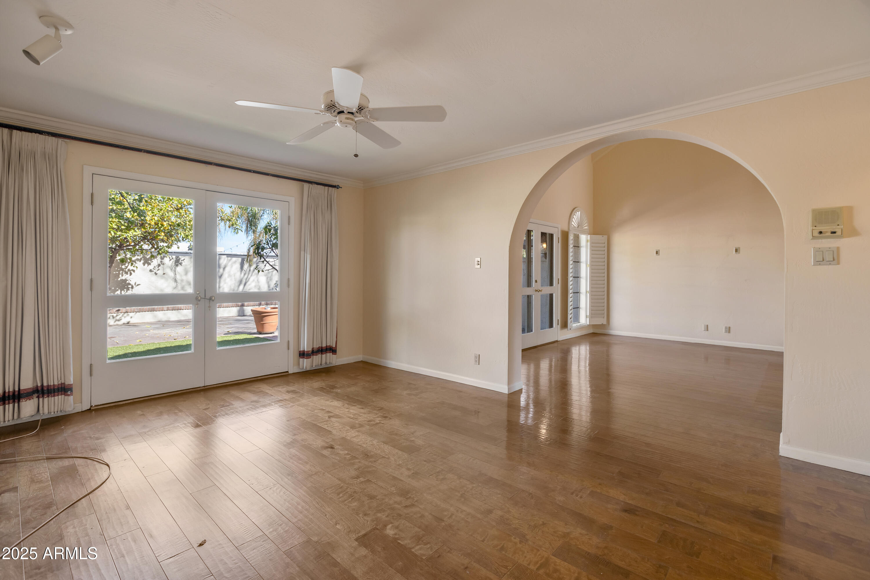 6701 North Scottsdale Road, Unit 23 Scottsdale, AZ 85250 - Photo 10 of 47 wooden floor in an empty room with a window