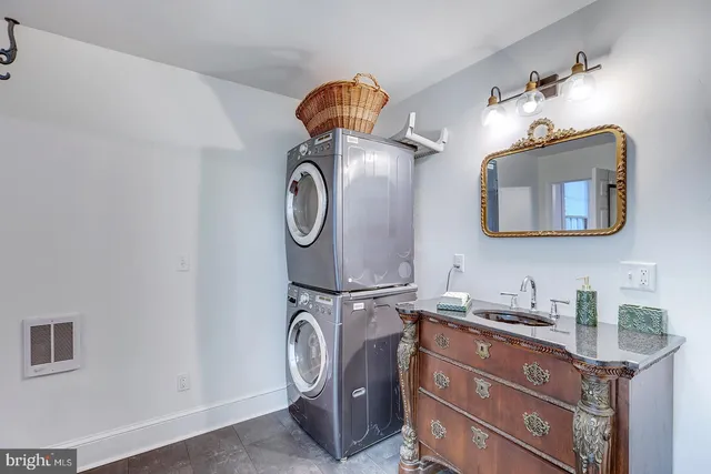 a living room with fireplace furniture and a flat screen tv