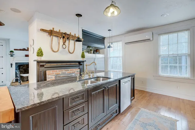 a front view of a building with a yard