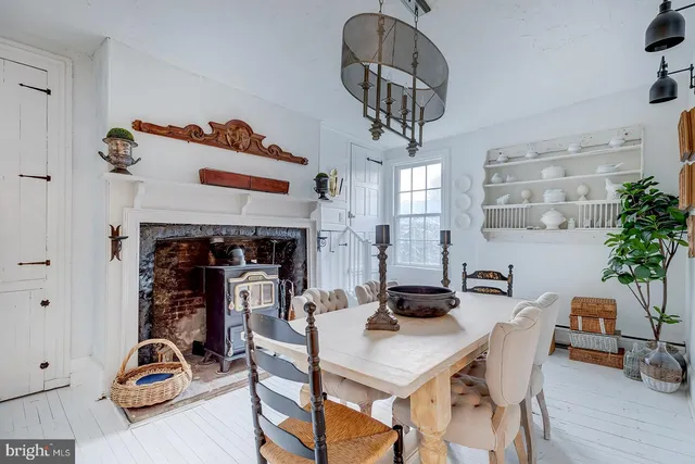 a view of a backyard with a table and chairs