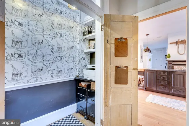 a kitchen with cabinets appliances a sink and a counter top space