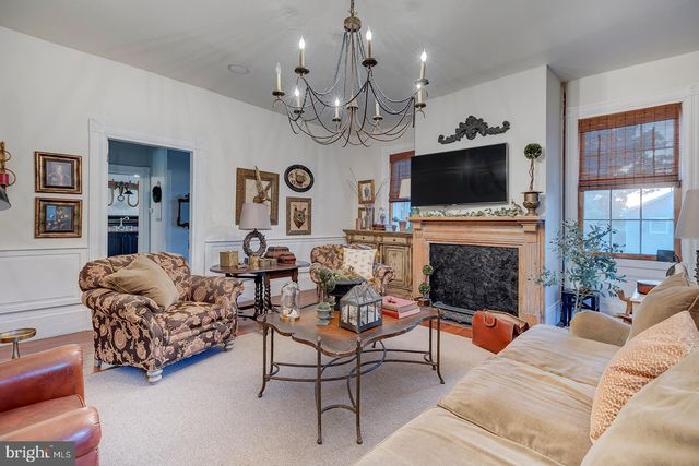 a bedroom with a bed and tv on the dresser