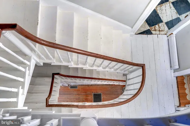 a bathroom with a toilet a sink and a mirror