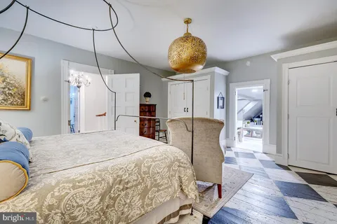 a view of a livingroom with furniture and a flat screen tv