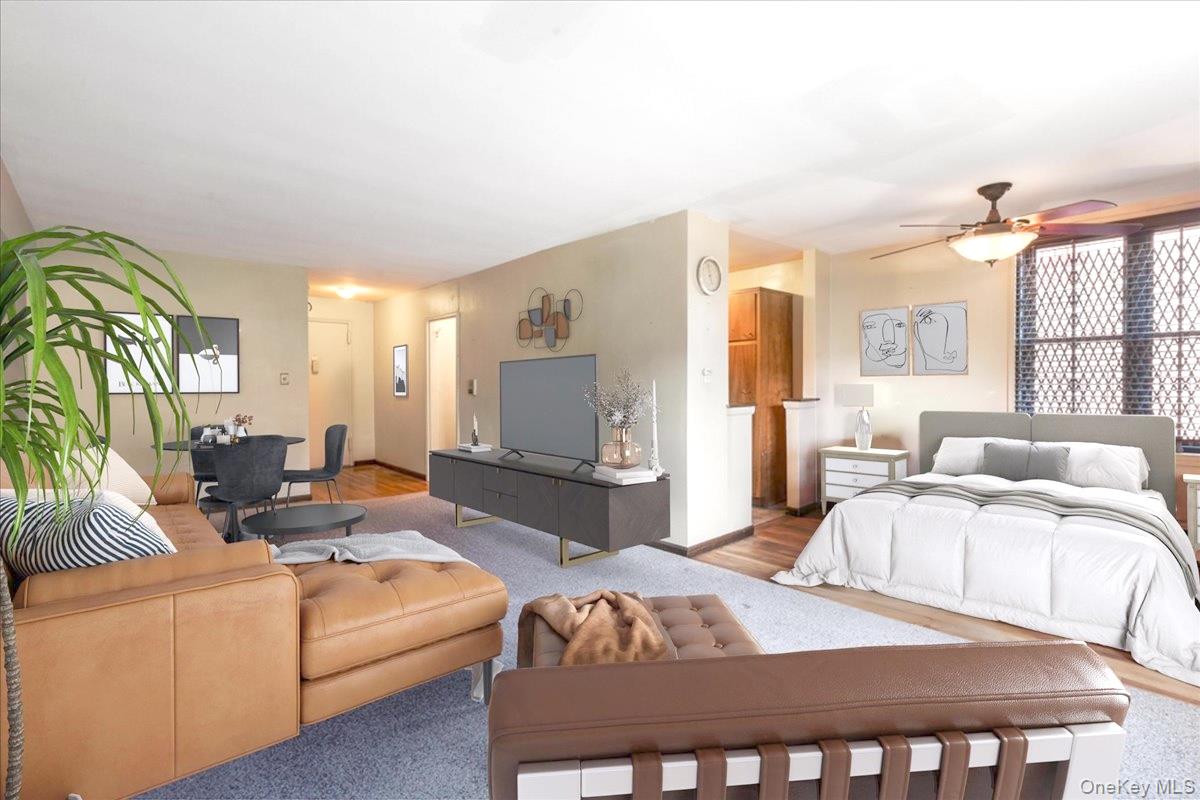 99-35 59th Avenue, Unit L5 Queens, NY 11368 - Photo 8 of 17 Carpeted bedroom with baseboards