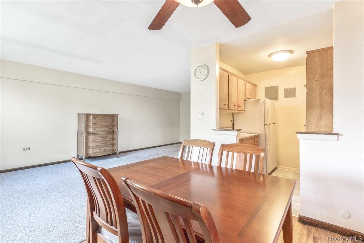 99-35 59th Avenue, Unit L5 Queens, NY 11368 - Photo 10 of 17 Dining space with baseboards and a ceiling fan