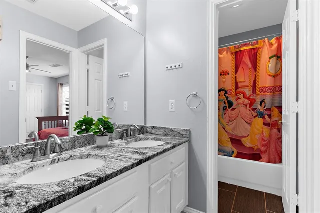 a view of an outdoor dining space with a table and chairs