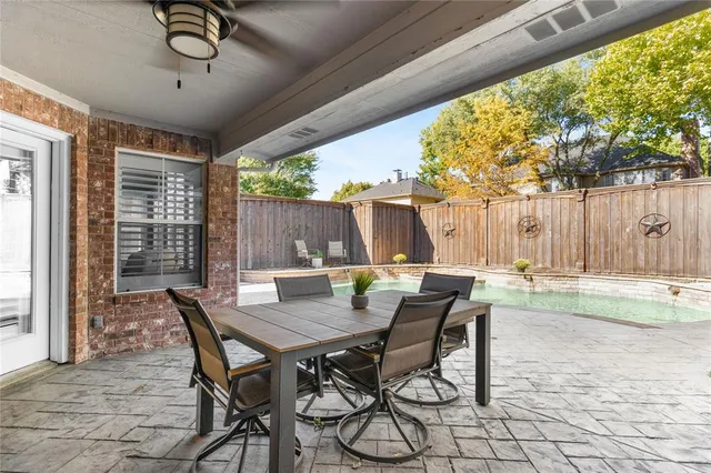 a view of a backyard with swimming pool