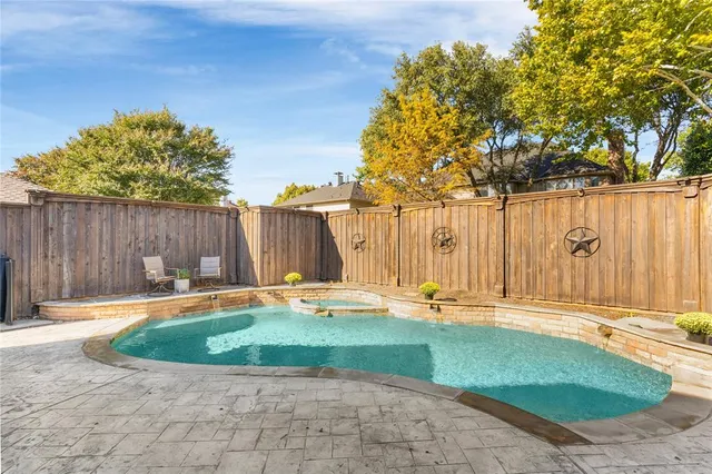a view of swimming pool with seating space