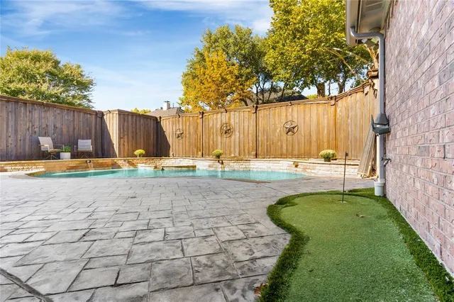 a view of a house with a yard porch and sitting area