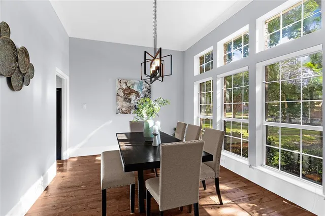 a view of a dining room with furniture window and wooden floor