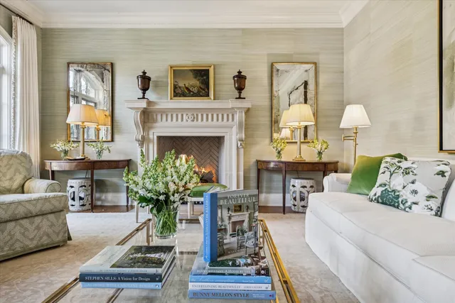 a view of a dining room with furniture and a window