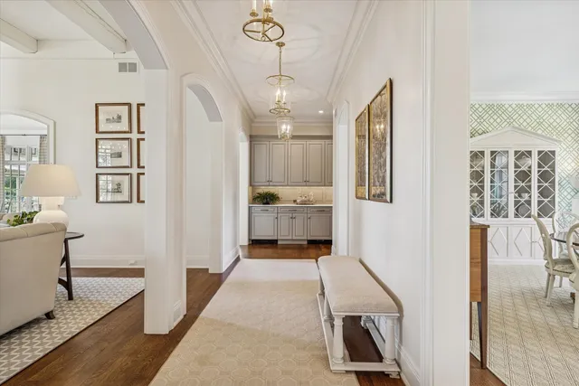 a living room with patio furniture and a large window