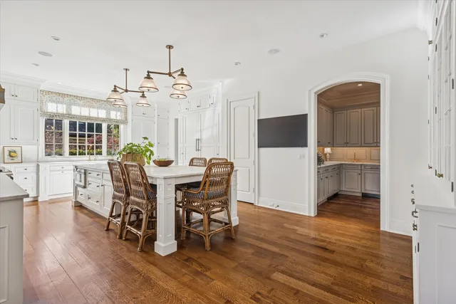 a bathroom with a double vanity sink mirror and shower