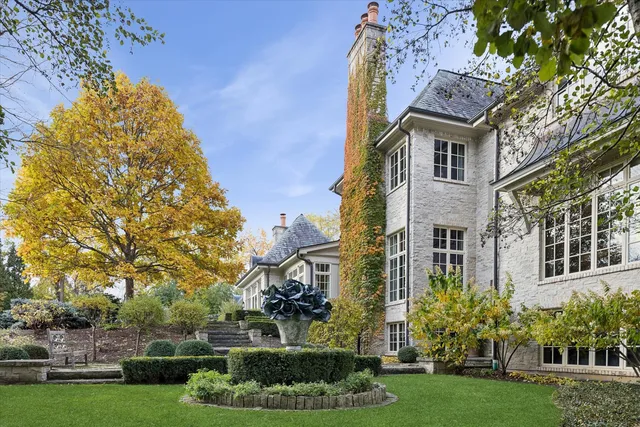 a living room with furniture fireplace and a window