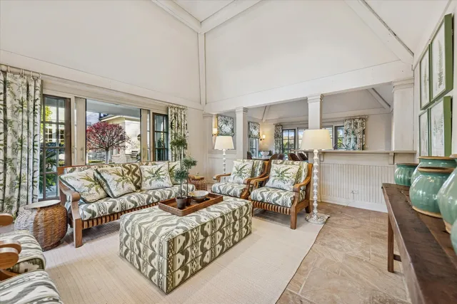 a view of a backyard with sitting area