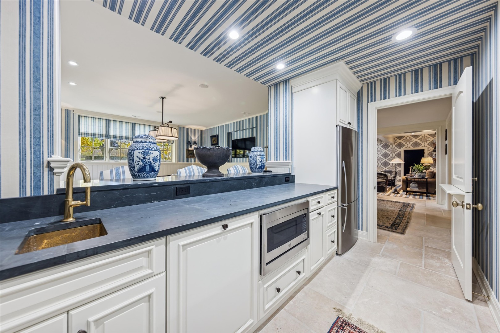 2450 Persimmon Drive St. Charles, IL 60174 - Photo 59 of 111 a kitchen with stainless steel appliances kitchen island granite countertop a sink and cabinets