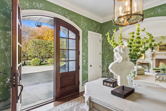 a view of a dining room with furniture wooden floor and chandelier