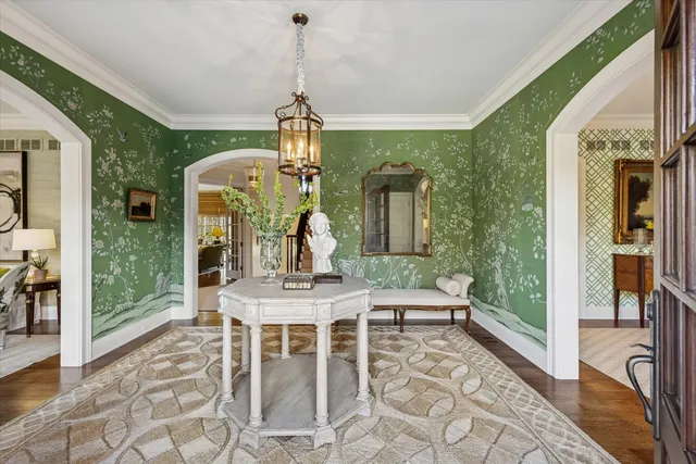 a dining room with furniture and wooden floor