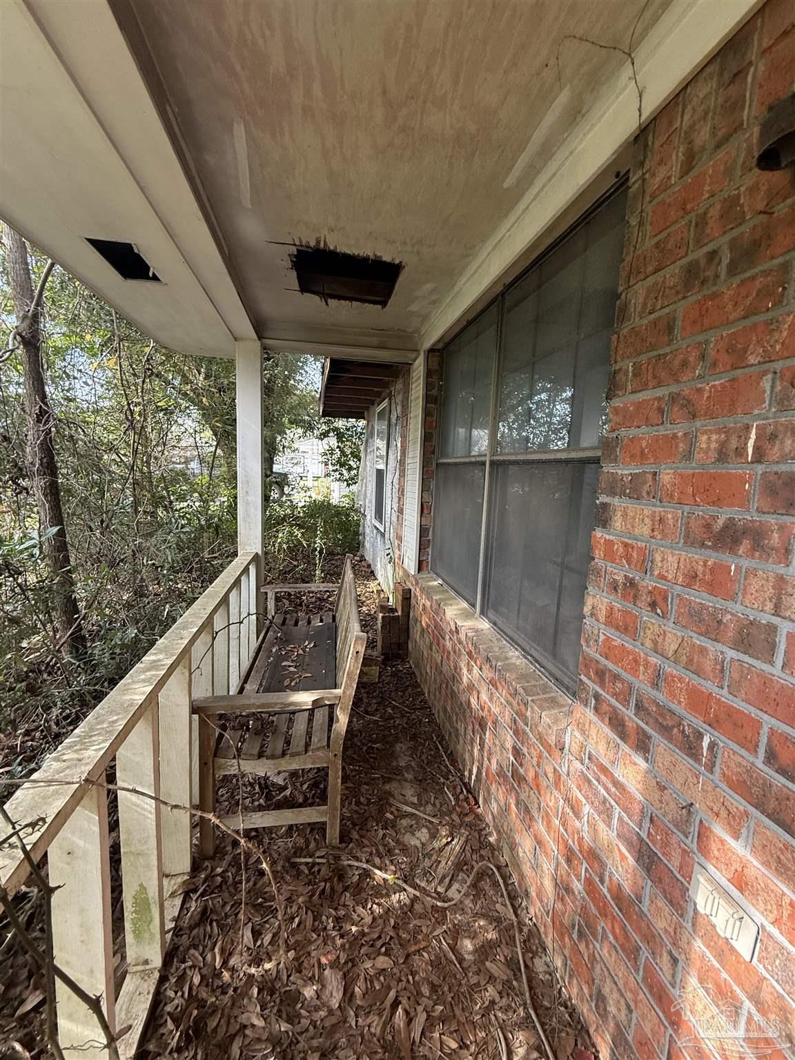 4444 Angie Lane Pace, FL 32571 - Photo 3 of 8 a view of a two chair in the balcony