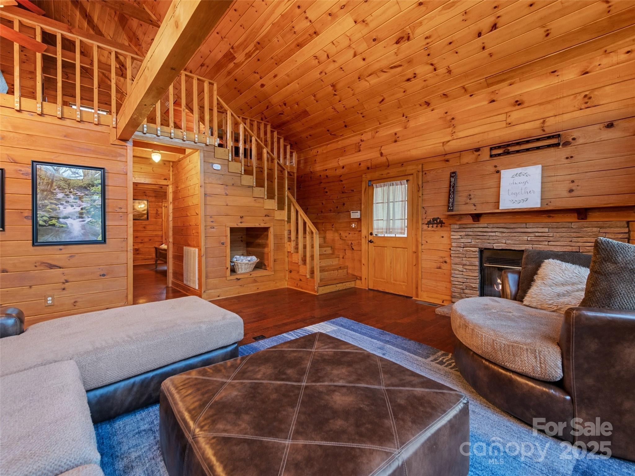 36 Wonder View Point Waynesville, NC 28785 - Photo 12 of 40 a view of a livingroom with furniture and a fireplace