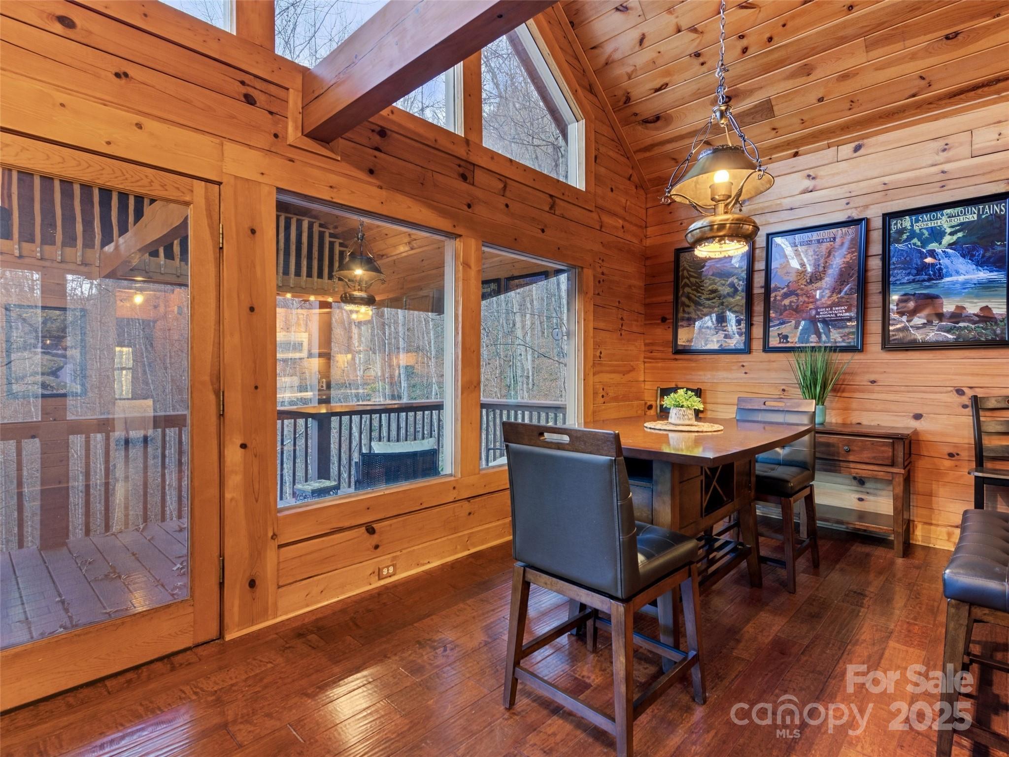 36 Wonder View Point Waynesville, NC 28785 - Photo 14 of 40 a view of a dining room with furniture window and wooden floor