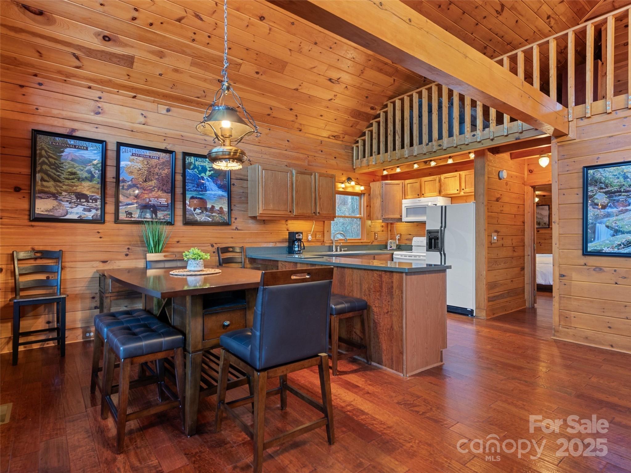 36 Wonder View Point Waynesville, NC 28785 - Photo 15 of 40 a view of a dining room with furniture and wooden floor