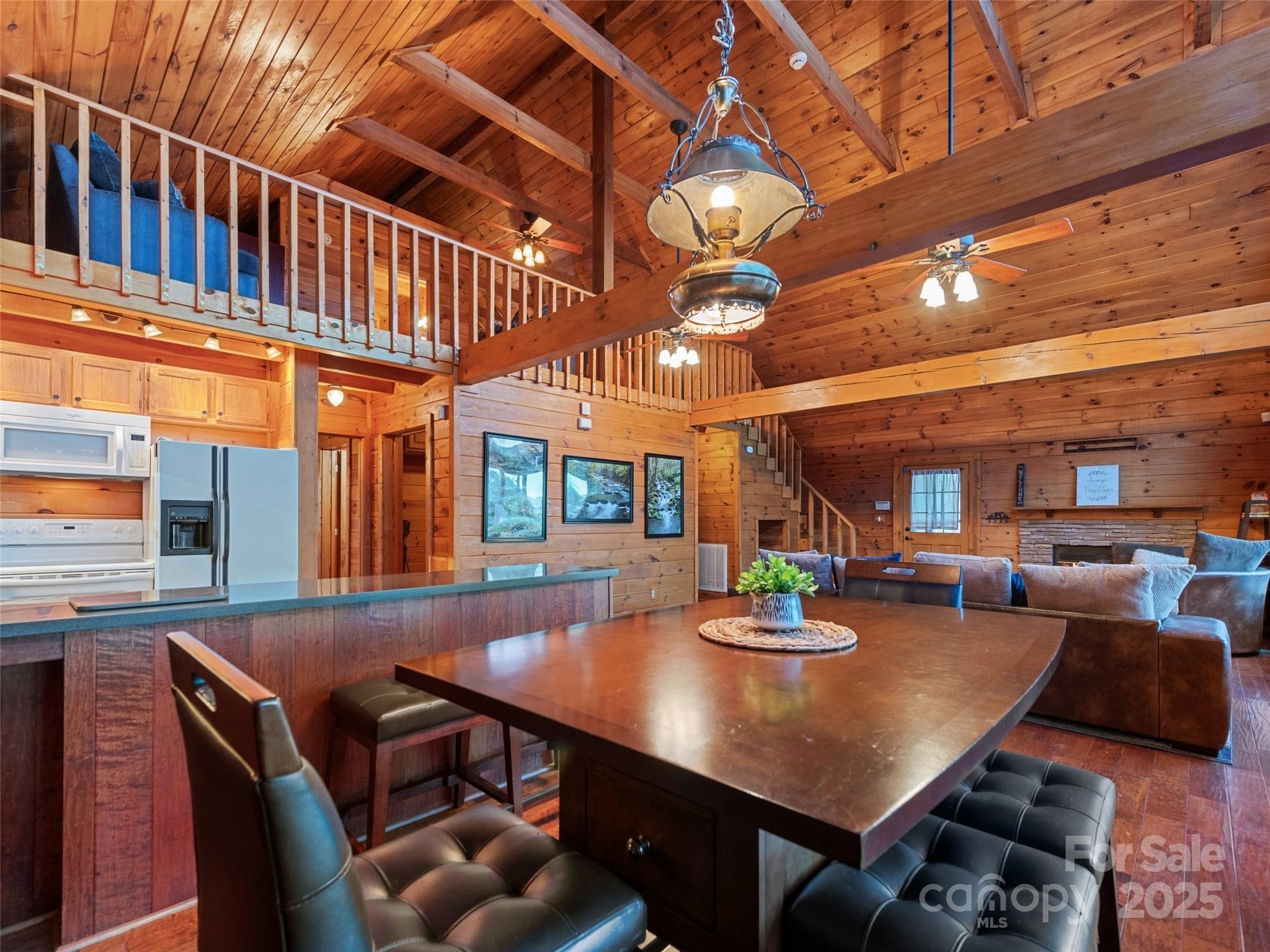 36 Wonder View Point Waynesville, NC 28785 - Photo 16 of 40 a view of a dining room with furniture and a chandelier