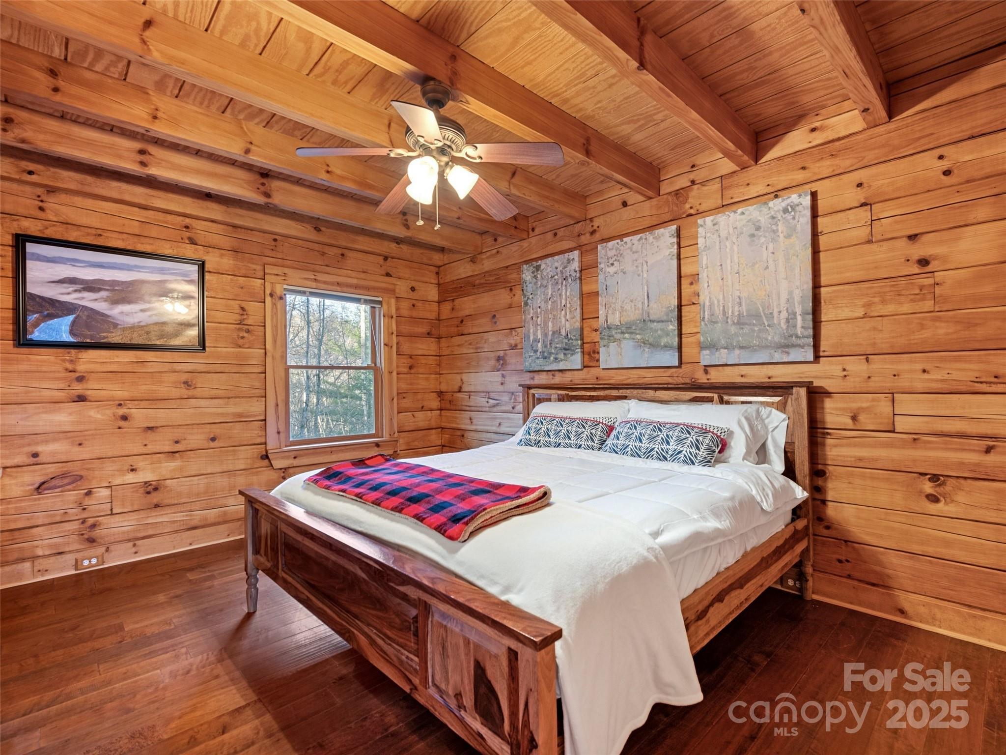 36 Wonder View Point Waynesville, NC 28785 - Photo 21 of 40 a bedroom with a bed and a dresser