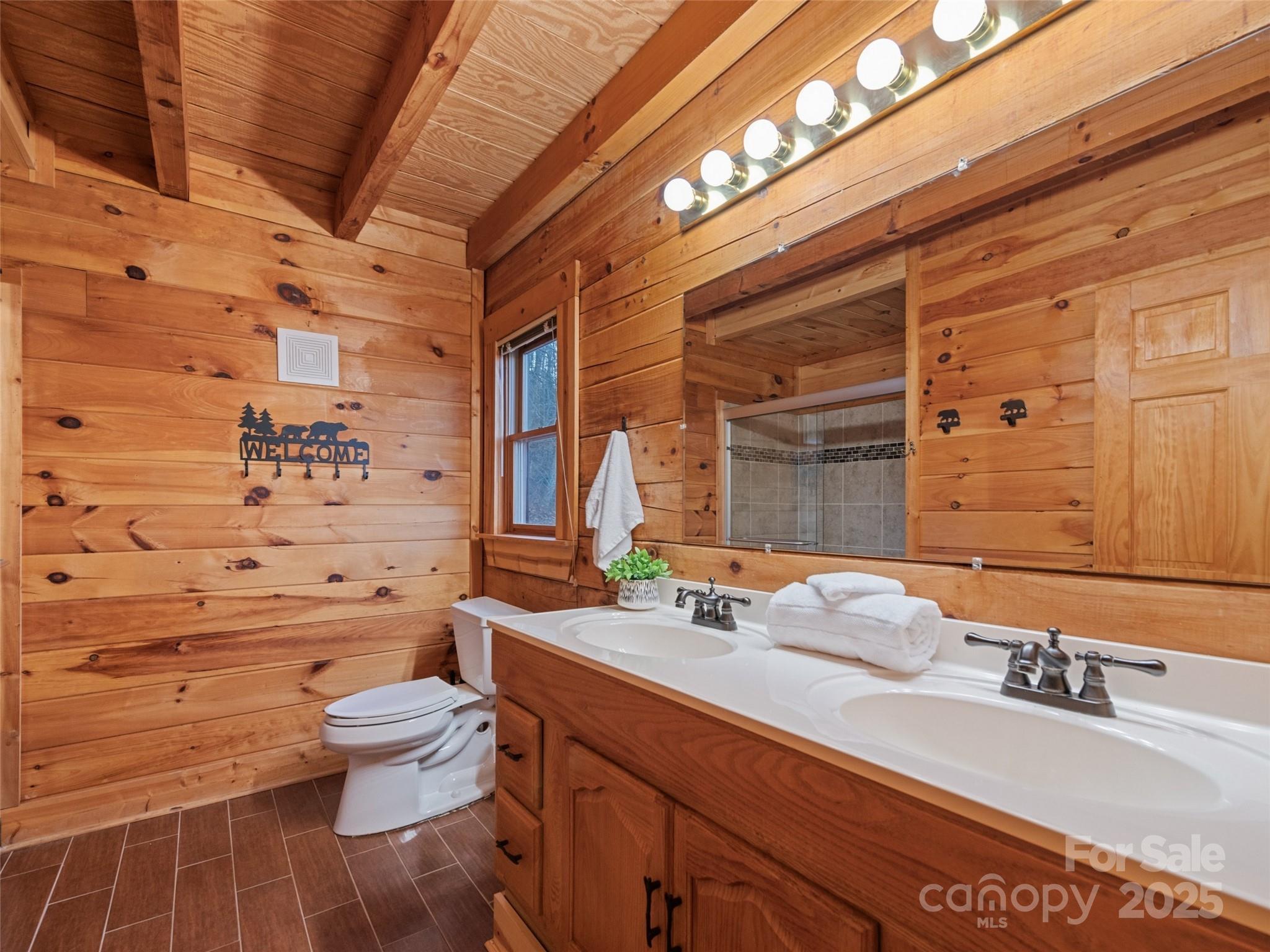 36 Wonder View Point Waynesville, NC 28785 - Photo 23 of 40 a bathroom with a sink a toilet and shower