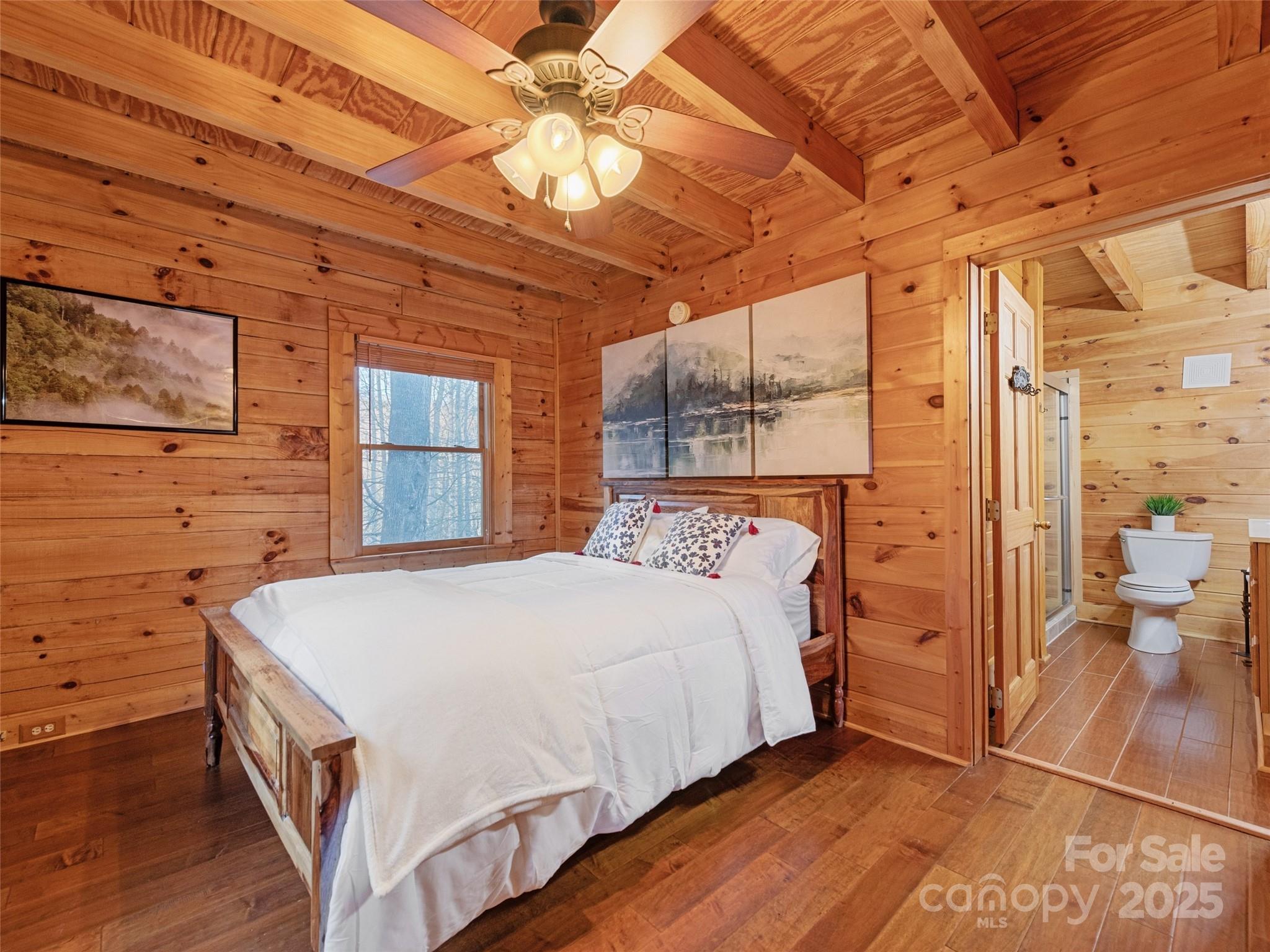 36 Wonder View Point Waynesville, NC 28785 - Photo 24 of 40 a bedroom with a bed and a large window