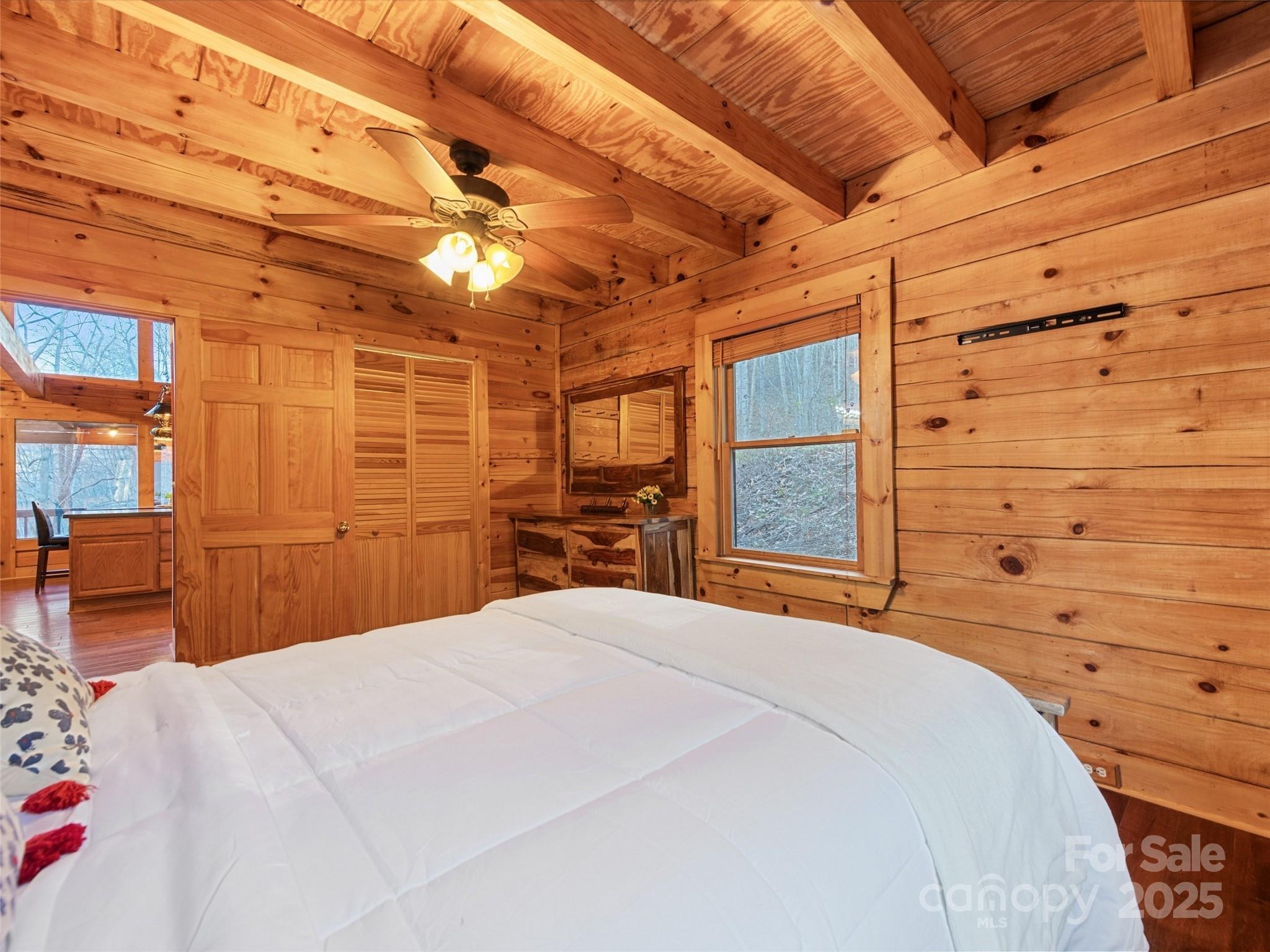 36 Wonder View Point Waynesville, NC 28785 - Photo 25 of 40 a bedroom with a bed and a view of closet