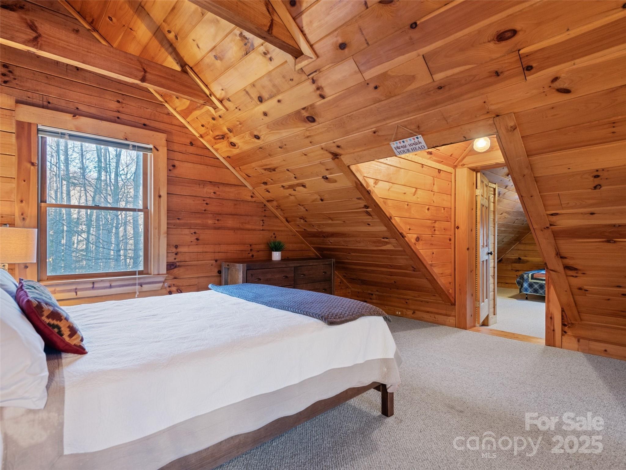 36 Wonder View Point Waynesville, NC 28785 - Photo 28 of 40 a bedroom with a bed and a large window