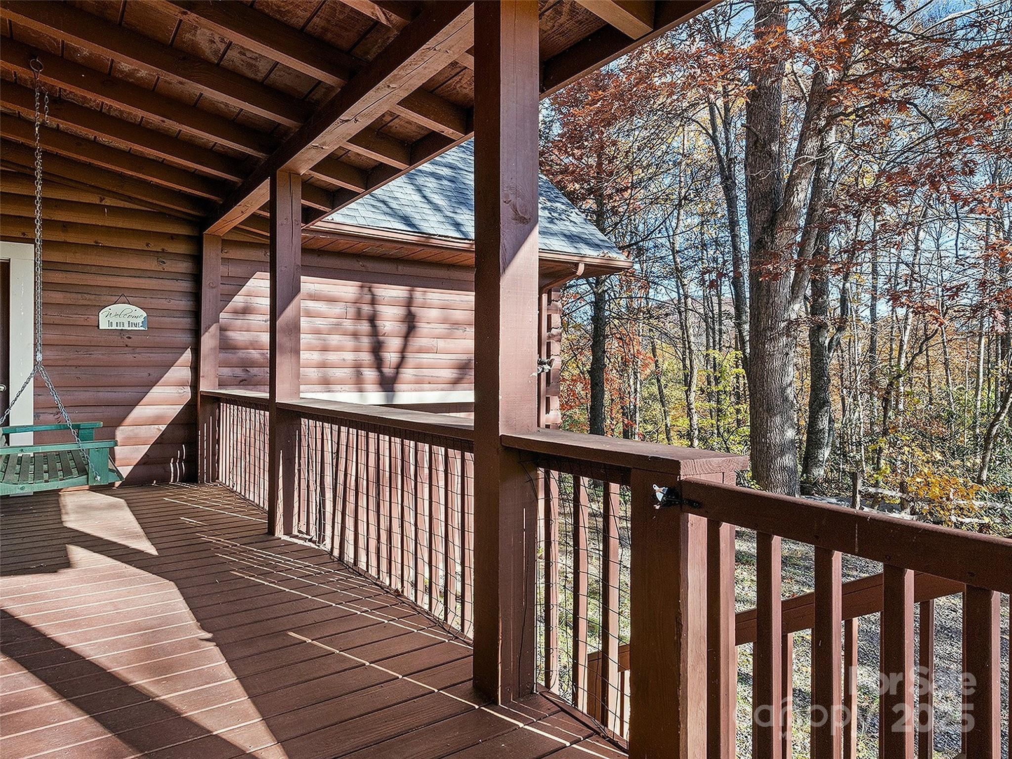36 Wonder View Point Waynesville, NC 28785 - Photo 36 of 40 a view of a balcony with wooden floor