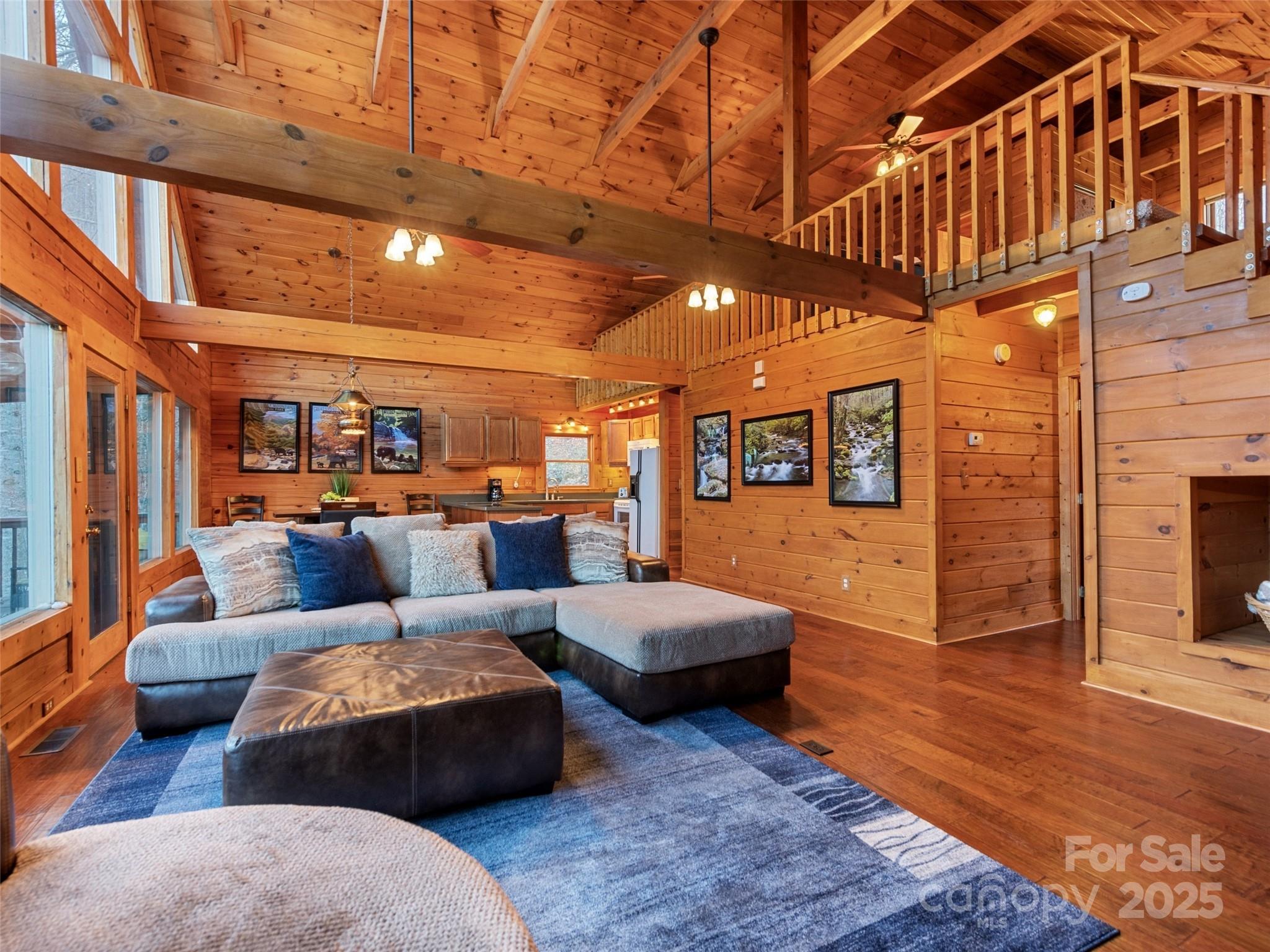 36 Wonder View Point Waynesville, NC 28785 - Photo 10 of 40 a living room with furniture a couch and wooden floor