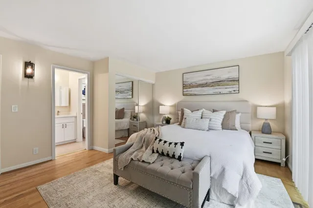 a bedroom with a bed and a view kitchen