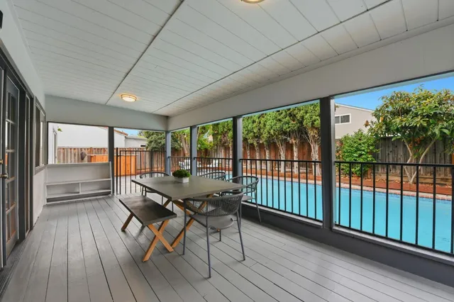 a dining room with furniture and wooden floor