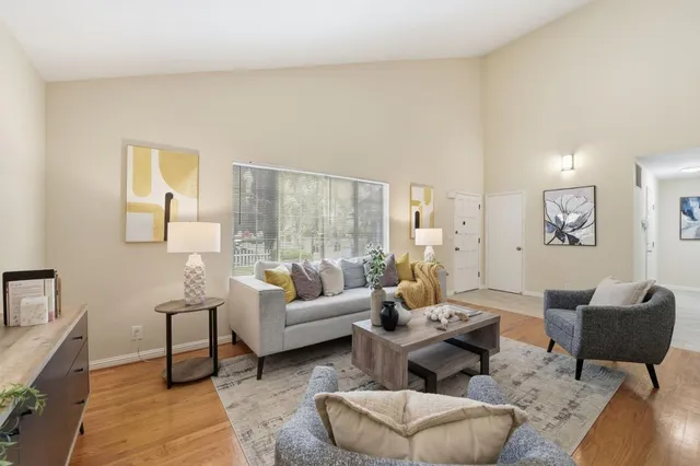 a living room with furniture and a large window