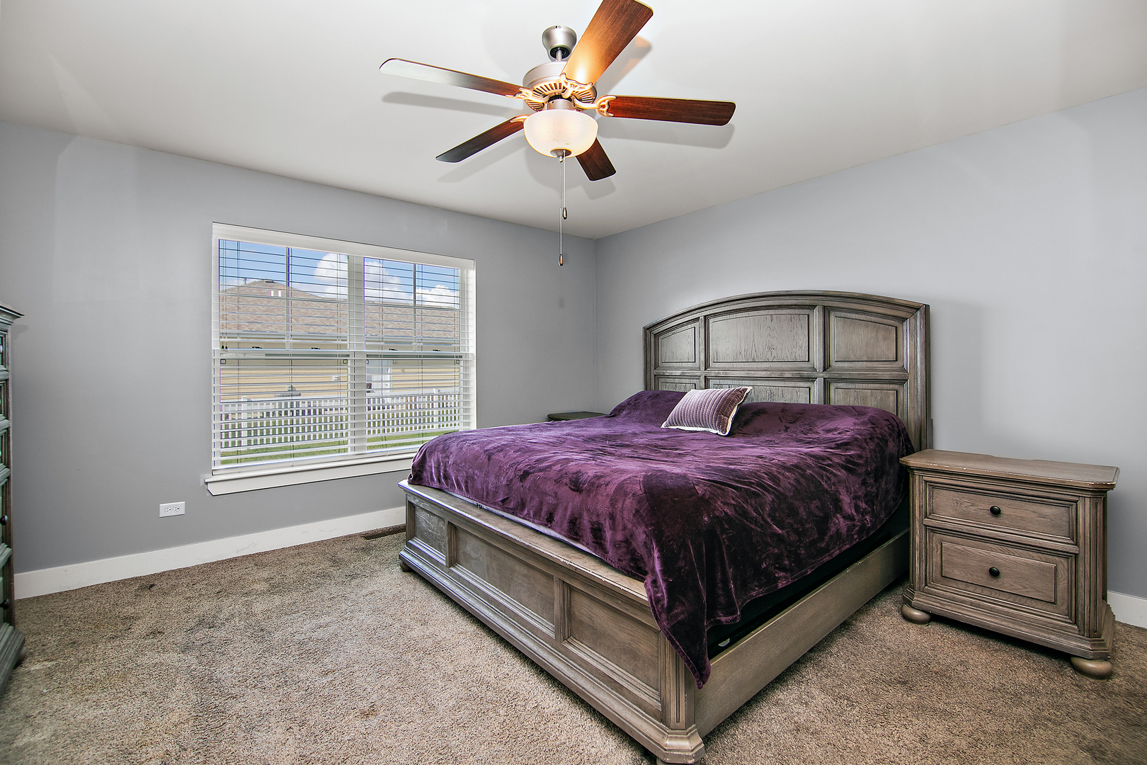 489 Cardinal Drive Manteno, IL 60950 - Photo 16 of 38 a spacious bedroom with a bed and a chandelier