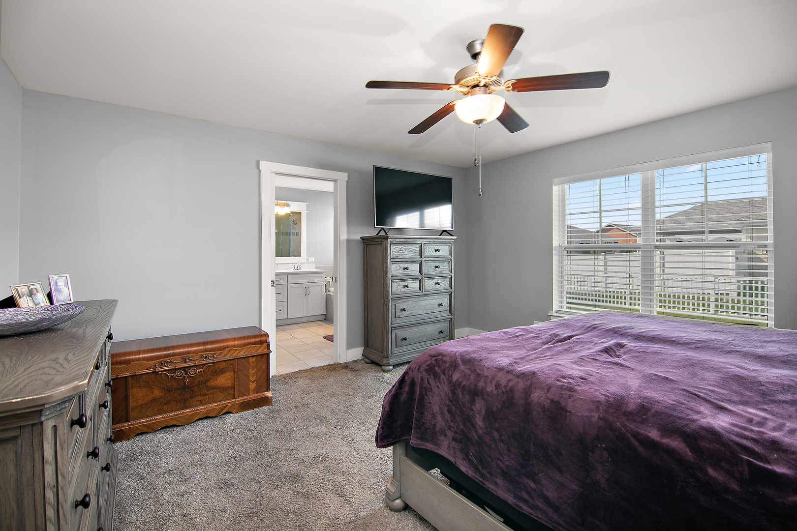 489 Cardinal Drive Manteno, IL 60950 - Photo 17 of 38 a bedroom with a bed and a television