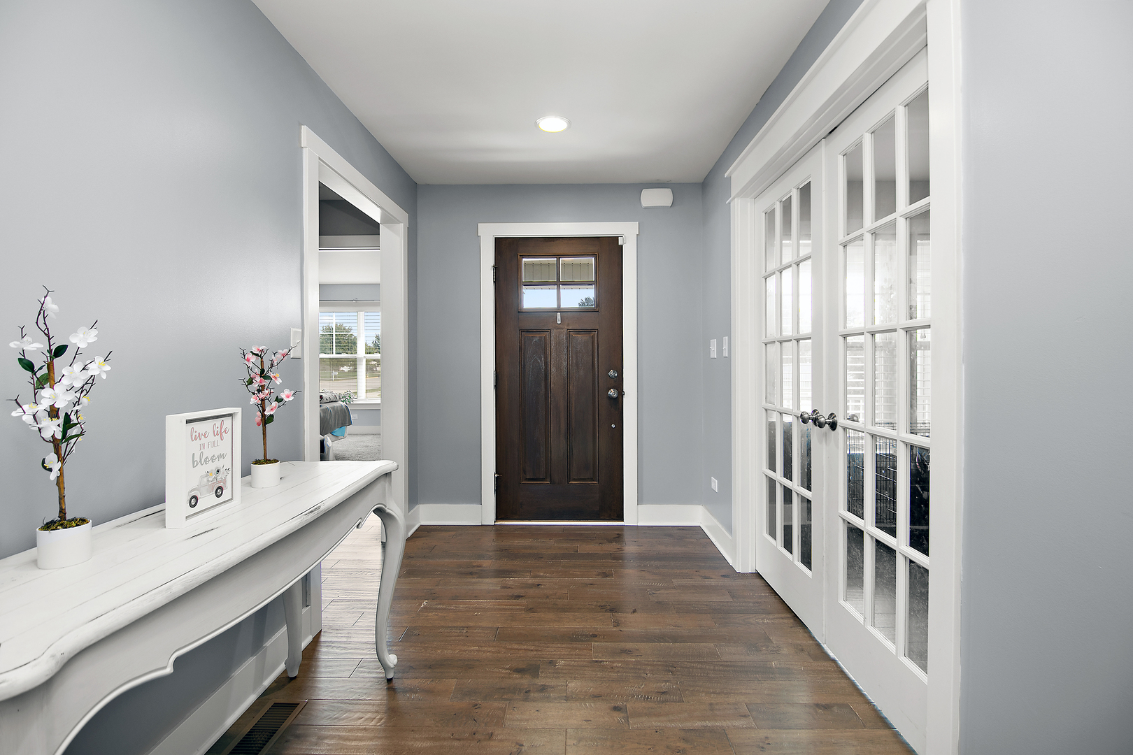 489 Cardinal Drive Manteno, IL 60950 - Photo 5 of 38 a view of a hallway with wooden floor and cabinet