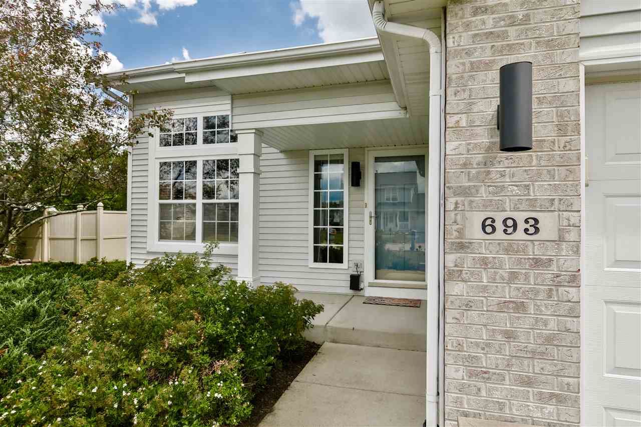 693 Bayfield Road Rockton, IL 61073 - Photo 1 of 26 a couple of potted plants in front of door