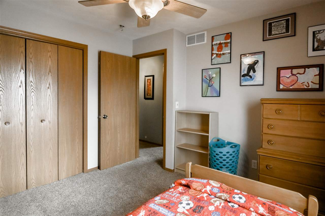 693 Bayfield Road Rockton, IL 61073 - Photo 21 of 26 a bedroom with a bed and a dresser